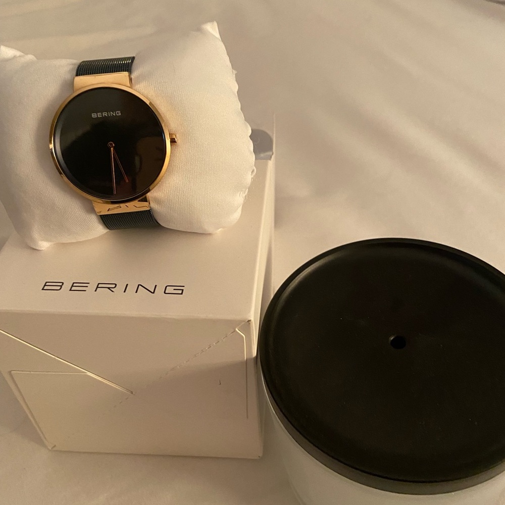 Bering dark navy blue and rose gold watch.